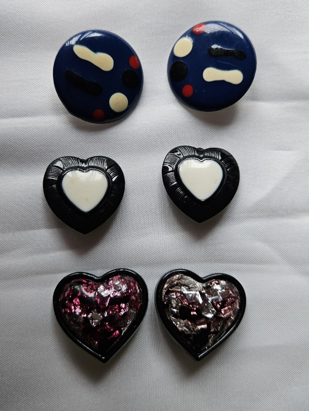 3 Pairs Of Earrings, Black/white, Pink Sparkle Hearts And Round Blue Art Deco.